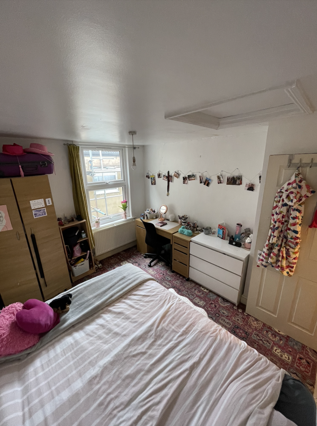 DOuble bedroom with desk, chest of drawers, wardrobe and storage side table